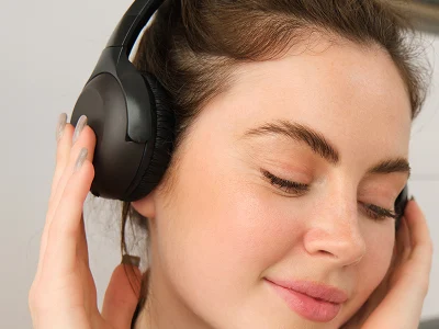 Woman relaxing with noise-cancelling headphones