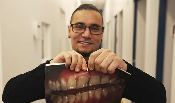 Restorative dentistry patient sharing his video testimonial
